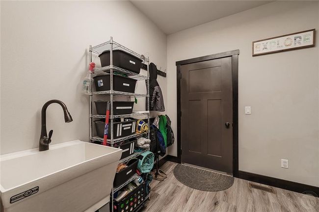 Laundry room/mud room off the garage with laundry sink. | Image 16