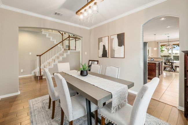 With easy access to both the kitchen and living areas, the formal dining room creates a perfect space for entertaining, offering sophistication and a welcoming atmosphere for every occasion | Image 12