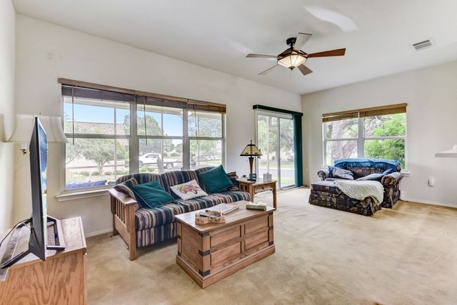 Living Room: "Spacious and cozy—this open-concept living room is the heart of the home, where relaxation meets style. ??? #OpenFloorPlan #HomeSweetHome" | Image 4
