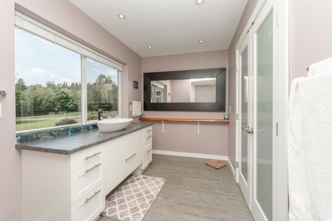 Bathroom featuring vanity, recessed lighting, and baseboards | Image 15