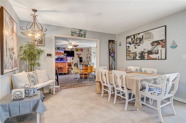 Dining room with ceiling fan | Image 54