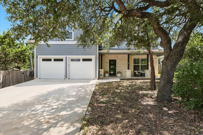 Front of the home with a covered porch | Image 6
