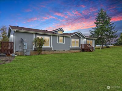 The Perfect Home- Imagine living in this beautiful home set on 2 acres of open space. With a spacious detached garage, there's plenty of room for hobbies, storage, and more. This property is the perfect blend of comfort and opportunity to create your dream lifestyle Photo is digitally enhanced | Image 1