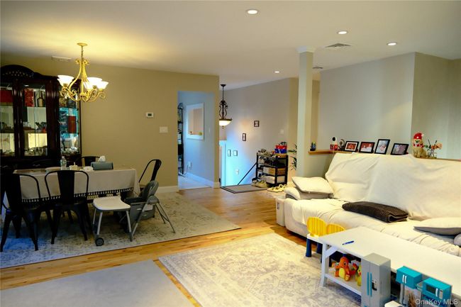 Living area with recessed lighting, light wood-type flooring, and a chandelier | Image 10