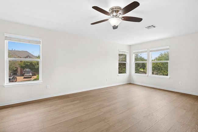 Unfurnished room featuring a ceiling fan and wood finished floors | Image 22