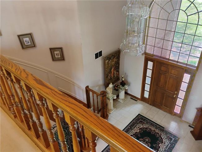 Tiled foyer entrance featuring, a high ceiling, and stairs | Image 62