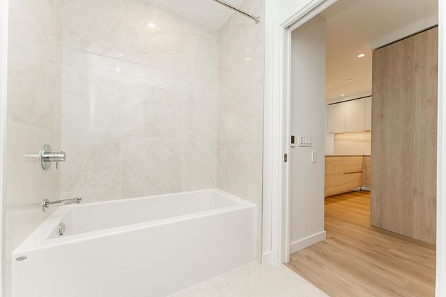 Full bathroom featuring recessed lighting, bathing tub / shower combination, and wood finished floors | Image 19