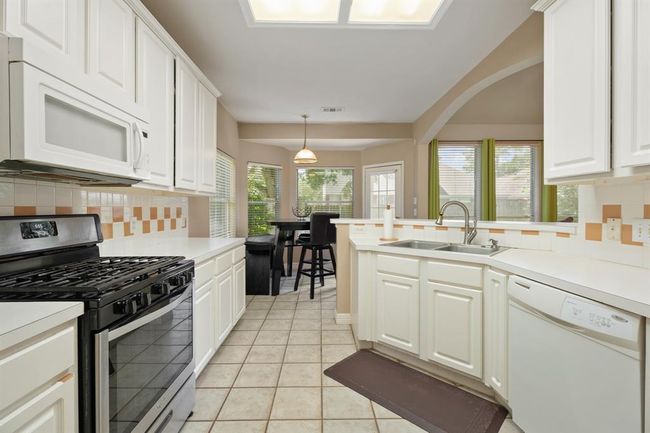 Your kitchen features a gas stove- perfect for cooking! | Image 7