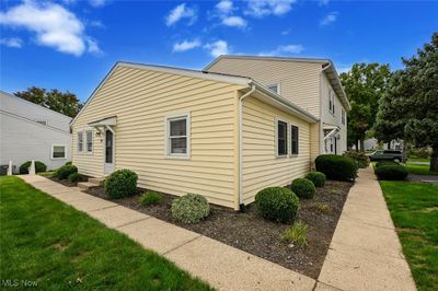 View of property exterior featuring a lawn | Image 2