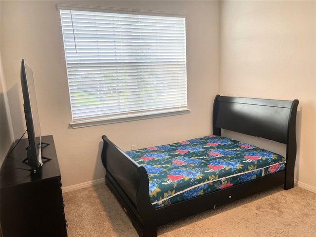 Carpeted bedroom featuring baseboards | Image 17