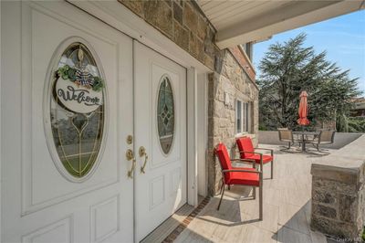 View of exterior entry and wrap around porch | Image 3