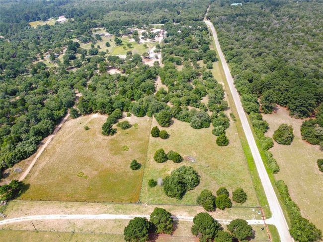 View of property location featuring property boundaries highlighted and a heavily wooded area | Image 39