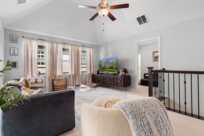 Living room featuring ceiling fan and vaulted ceiling | Image 12