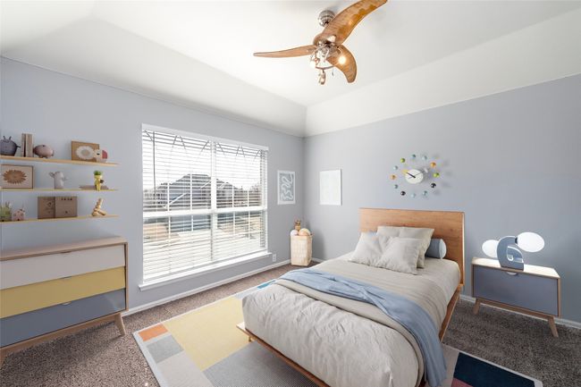 Bedroom with carpet, baseboards, vaulted ceiling, and a ceiling fan | Image 16