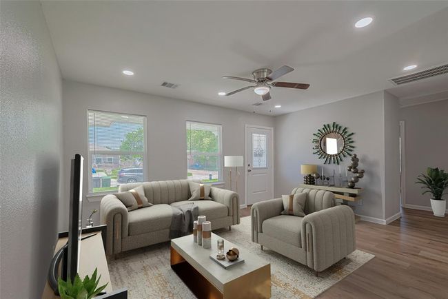Step through the front door into a bright and welcoming living space, where large windows bring in natural light. *virtually staged** | Image 5