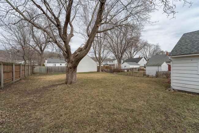 Flat yard is fully fenced in. | Image 30