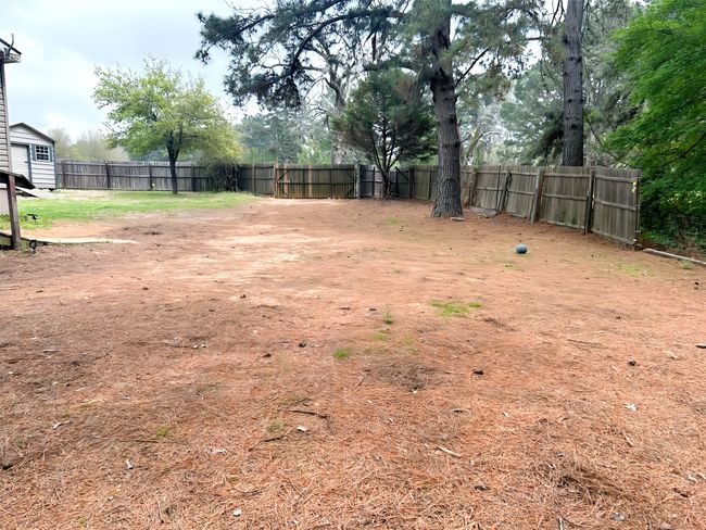 View of yard featuring fence | Image 34