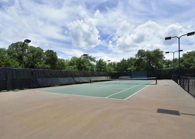 View of tennis court with community basketball court | Image 39