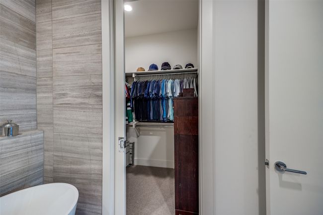 Full bath with a freestanding tub and a walk in closet | Image 25