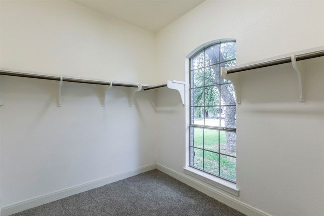 Spacious closet with carpet floors | Image 21
