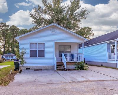 View of front of home with covered porch | Image 1