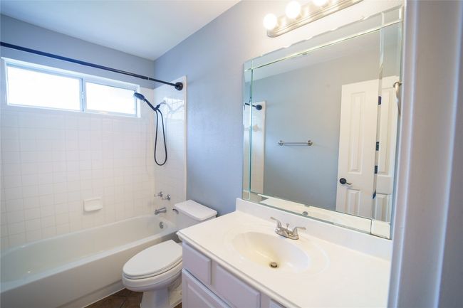 Full bath featuring vanity, tub / shower combination, and toilet | Image 28