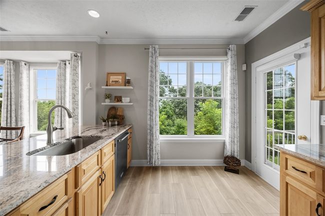 The seller installed solar shades for the blinds to cut down on heat and glare. A paneled glass door leads to the 2nd back patio. | Image 15