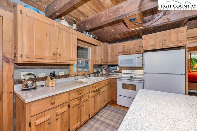 The custom cabinets offer abundant storage. | Image 9