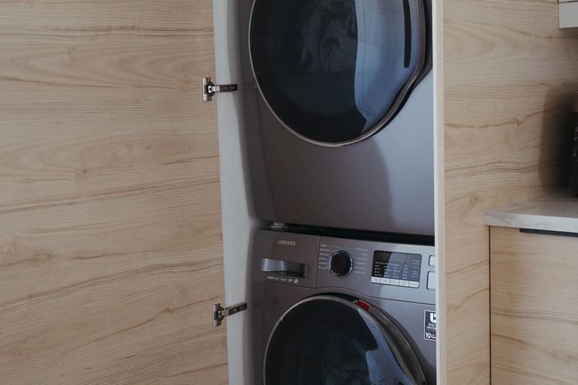 Washroom featuring stacked washer / dryer | Image 12