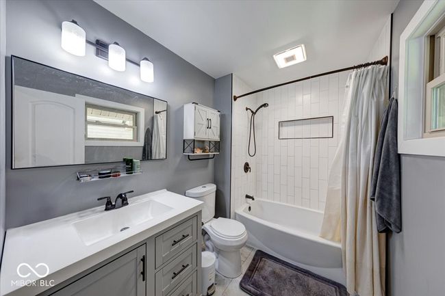master bathroom with beautiful tiled full bath | Image 36
