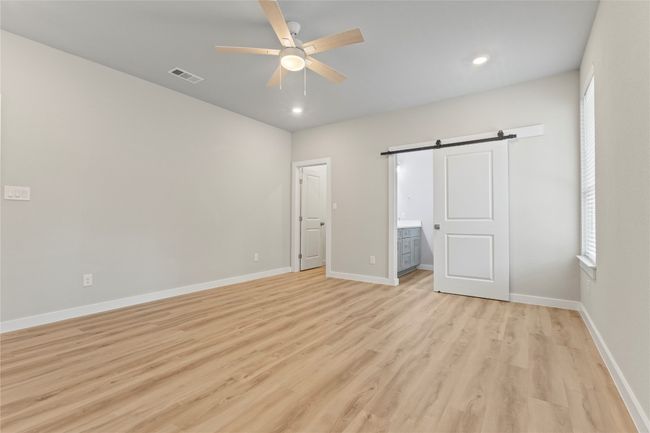 An exceptional primary bedroom with generous space and effortless elegance. | Image 17