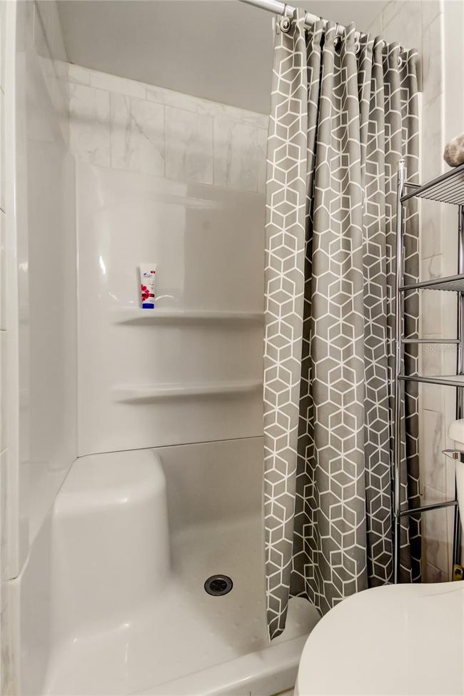 8. FULLY UPDATED Owners Retreat Ensuite (4.1 x 7.11') Provides Easy Walk In Shower w Bench & Shelves for all Your Shower Things!. | Image 8