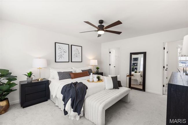 Bedroom featuring light colored carpet, baseboards, and a ceiling fan | Image 16