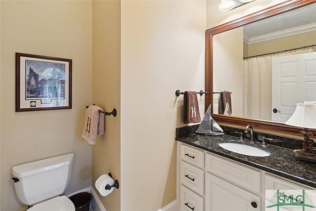 The third bathroom has a shower/tub combo. | Image 35