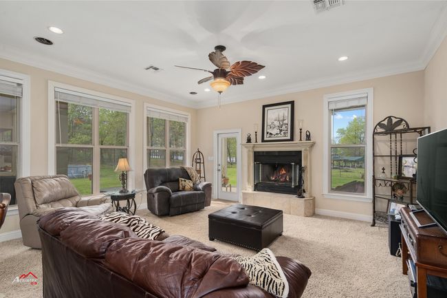View of the family room with visual access to the lake. | Image 21