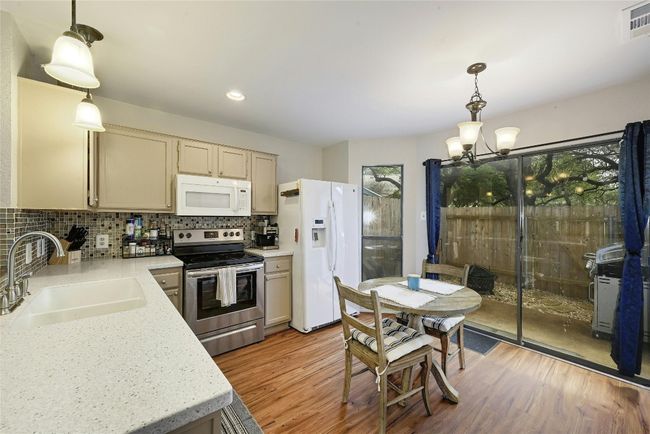 Kitchen area with easy access to the back patio | Image 7