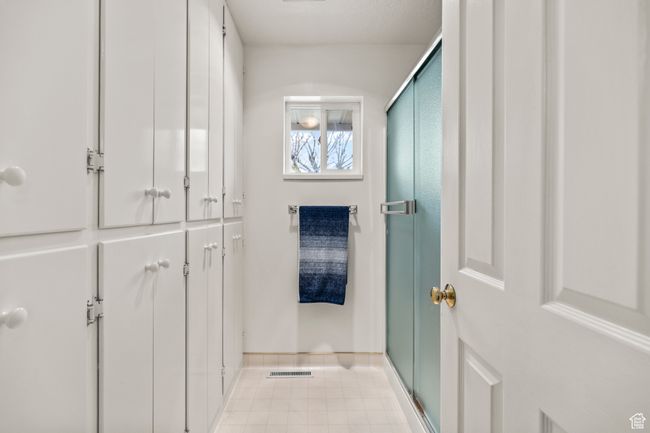 Master bedroom bathroom, featuring built-in cabinets | Image 21