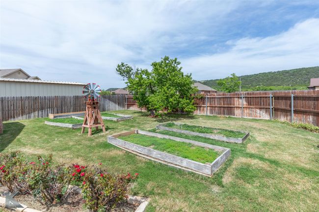 View of yard with a vegetable garden | Image 37