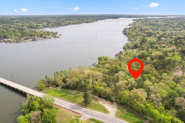 Birds eye view of property with a wooded view and a water view | Image 13