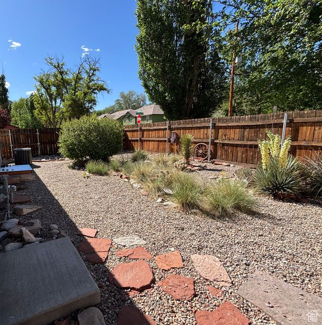 Fenced backyard with cooling unit | Image 38