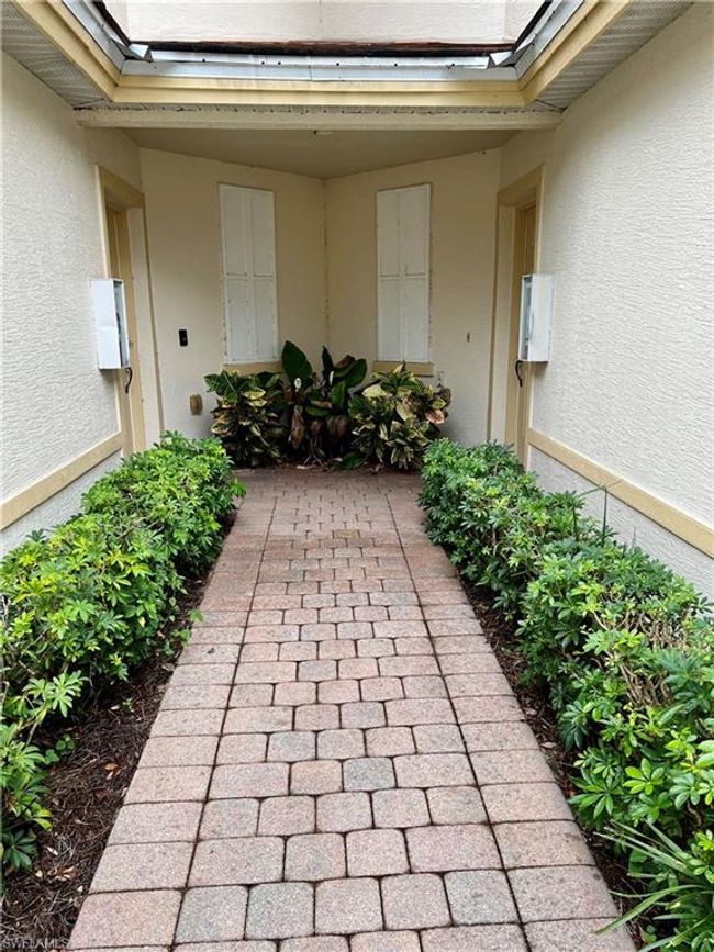 Walkway to entry which is on the left | Image 4