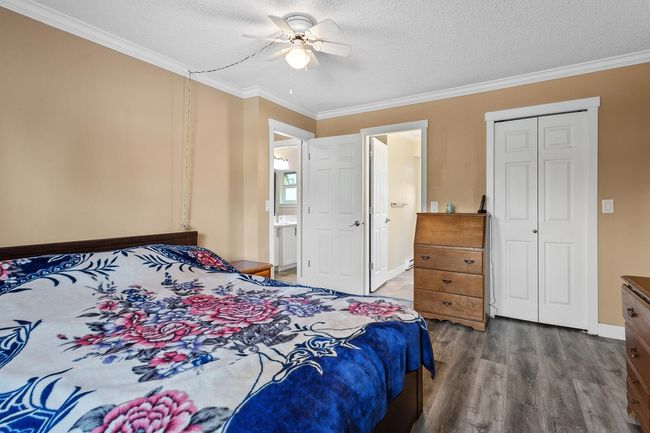 Bedroom with ceiling fan, crown molding and ensuite bathroom | Image 18