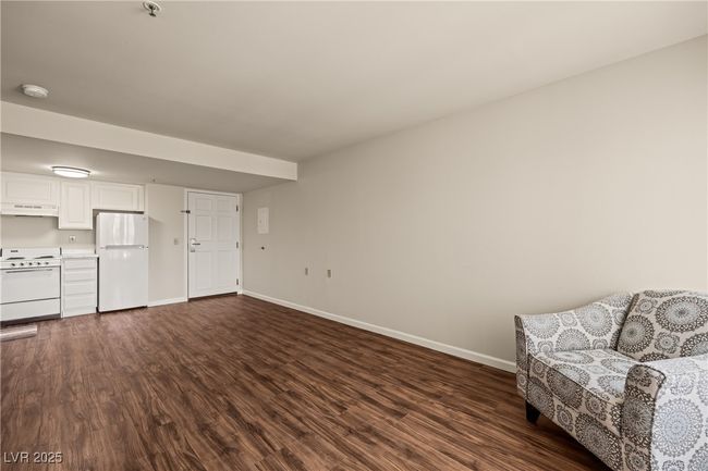Sitting room with dark wood-style floors and baseboards | Image 8