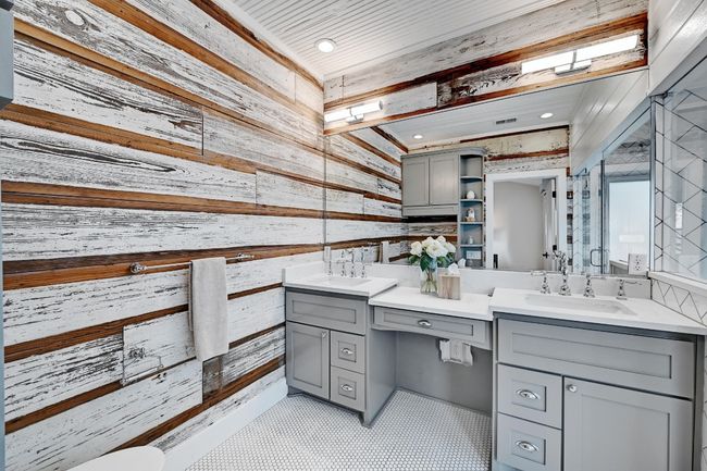 Original shiplap highlights the vanity in the primary bathroom | Image 19