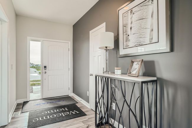 Photo is of the model. Make the best first impression with this bright and open foyer. Thoughtfully-designed to leave plenty of room for your guests to arrive and feel comfortable. | Image 9
