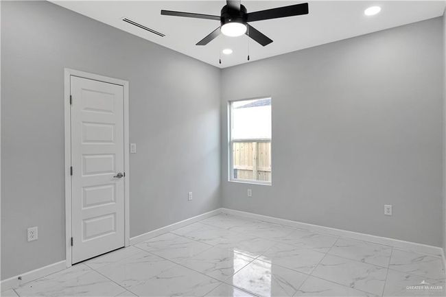 Spare room with recessed lighting, baseboards, marble finish floor, ceiling fan, and visible vents | Image 10