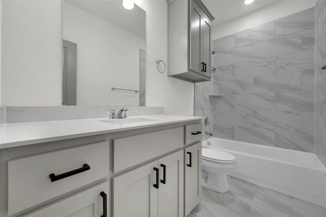 Bathroom featuring vanity, recessed lighting, bathing tub / shower combination, toilet, and marble finish floor | Image 15