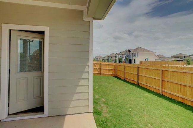 View of yard with fence and a residential view | Image 22