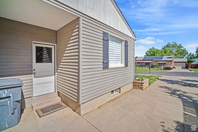 View of exterior entry featuring board and batten siding | Image 13