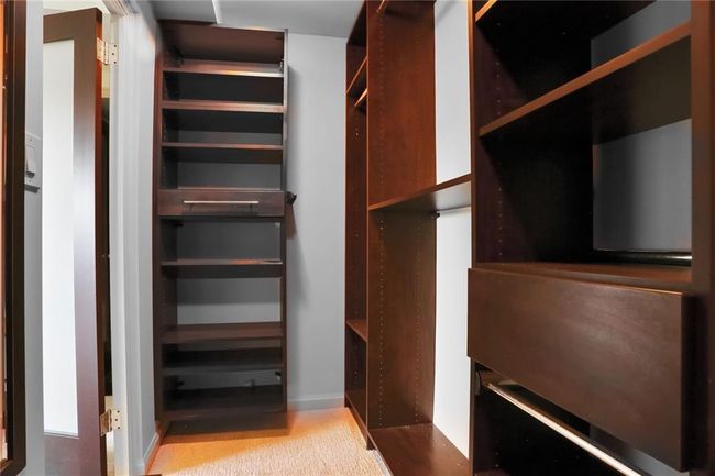 Community laundry room with washer and clothes dryer and visible vents | Image 16
